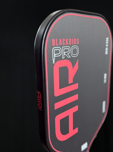 Blackbird Pro pickleball paddle with red and white text on a black background