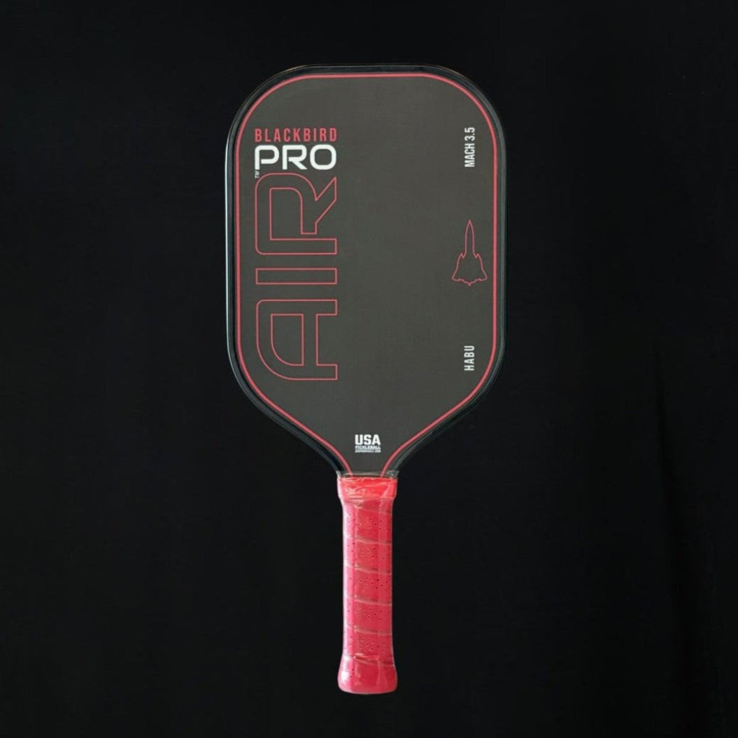 Black and red pickleball paddle with 'AIR' branding on a black background