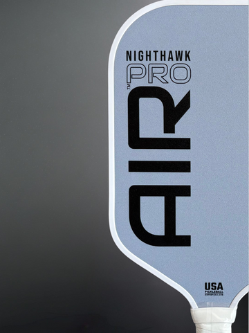Nighthawk Air Pro pickleball paddle on a gray background